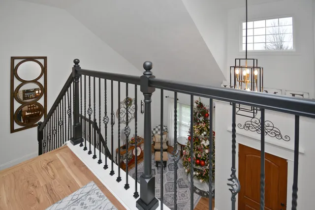 a view of a house with a yard and deck