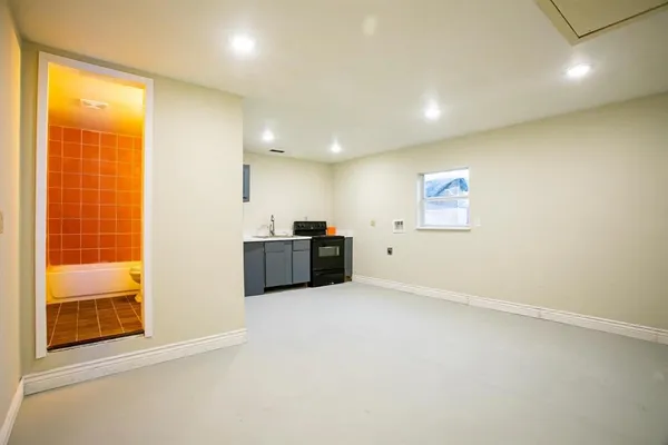 a view of an empty room with a window