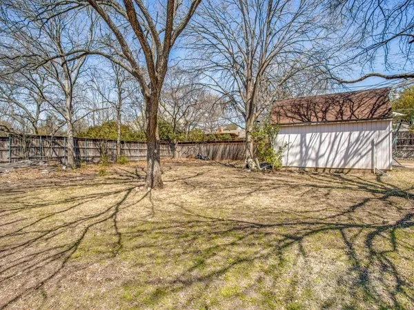 a view of large yard with patio