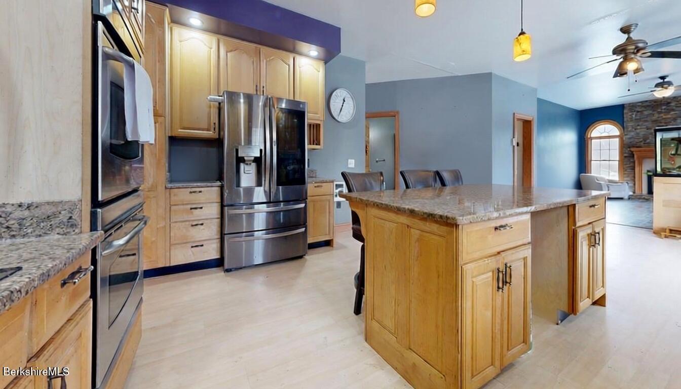 867 Notch Road Cheshire, MA 01225 - Photo 14 of 37 a kitchen with stainless steel appliances granite countertop a refrigerator and a stove