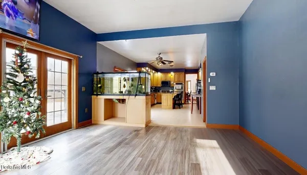 a view of a dining room with furniture window and wooden floor