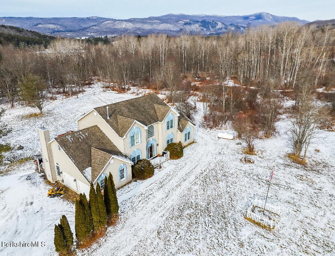 867 Notch Road Cheshire, MA 01225 - Photo 2 of 37 a view of a lake with mountain