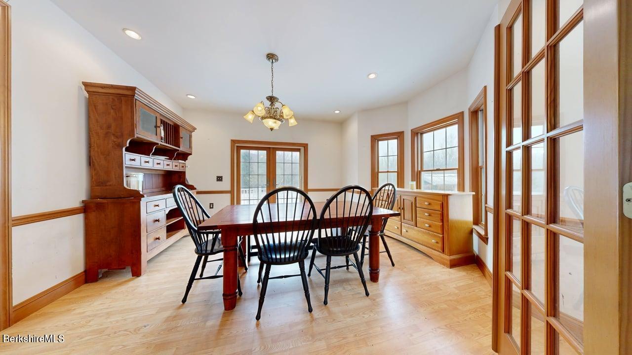 867 Notch Road Cheshire, MA 01225 - Photo 22 of 37 a view of a dining room with furniture window and wooden floor