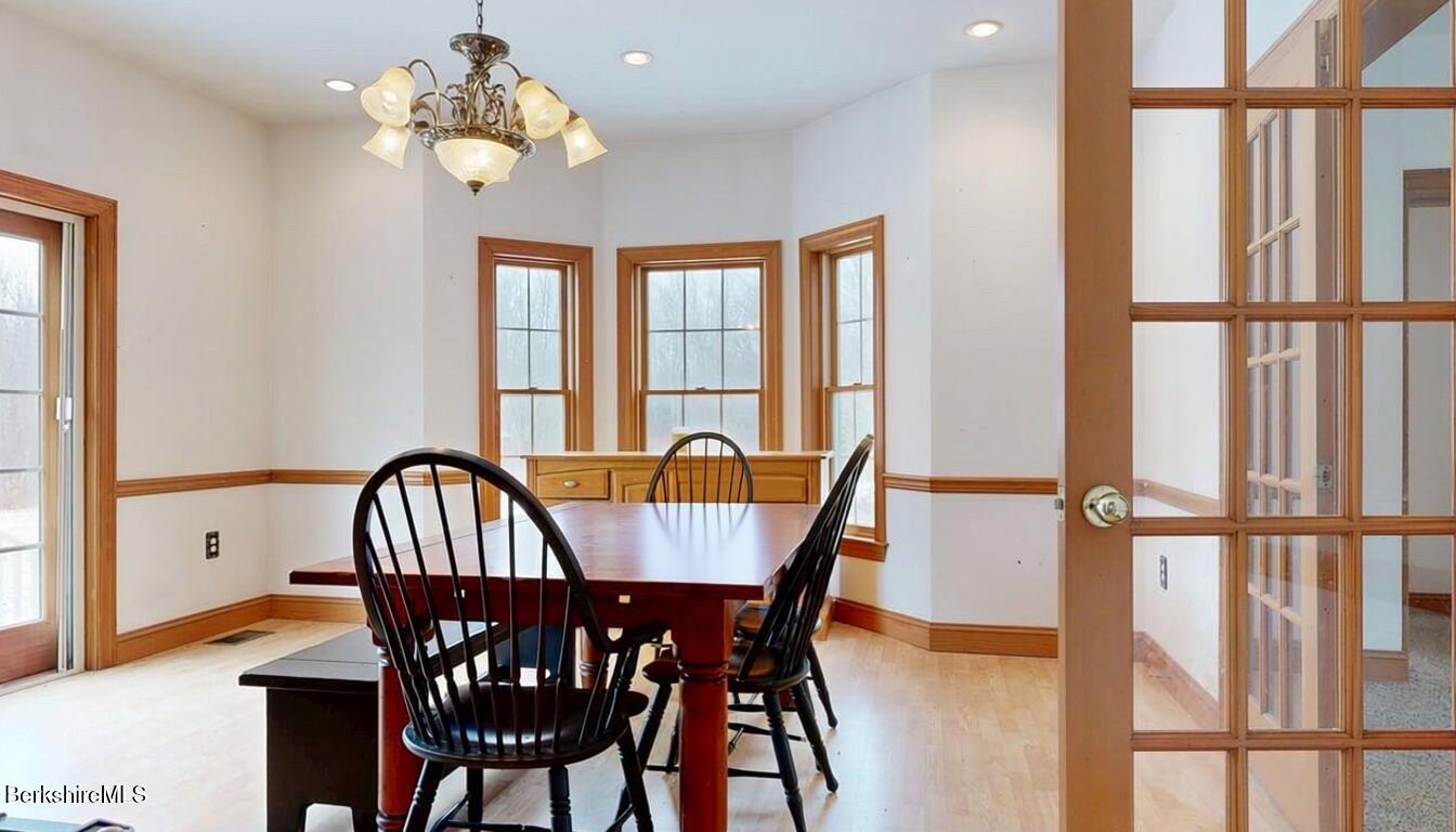 867 Notch Road Cheshire, MA 01225 - Photo 23 of 37 a view of a dining room with furniture window and wooden floor