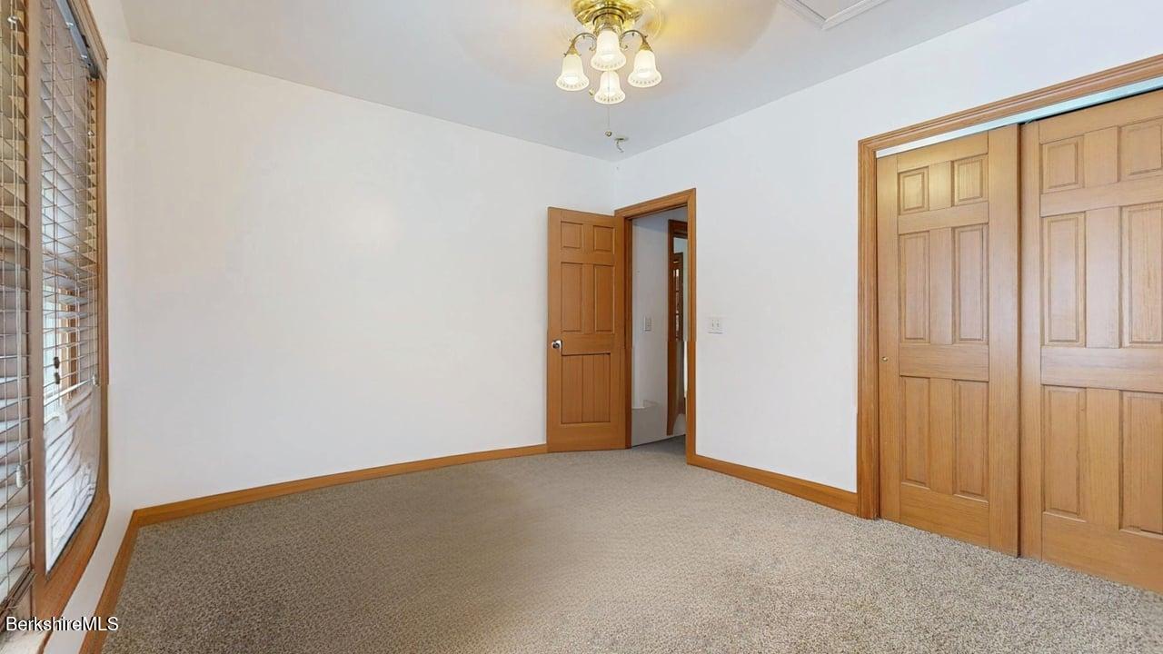867 Notch Road Cheshire, MA 01225 - Photo 25 of 37 an empty room with windows and closet