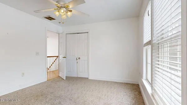 a bed room with a bed and a chandelier