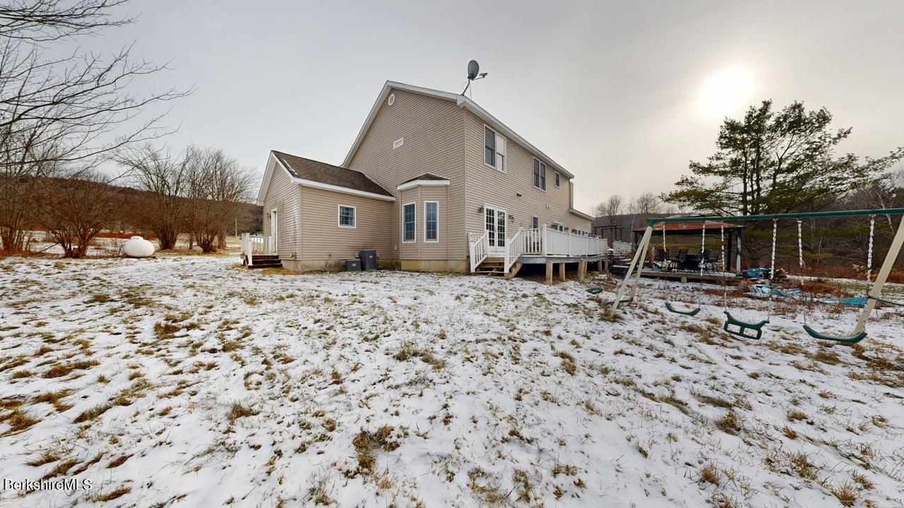 867 Notch Road Cheshire, MA 01225 - Photo 33 of 37 a front view of a house with a yard