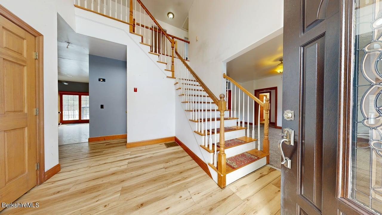 867 Notch Road Cheshire, MA 01225 - Photo 10 of 37 a view of entryway with wooden floor and stairs