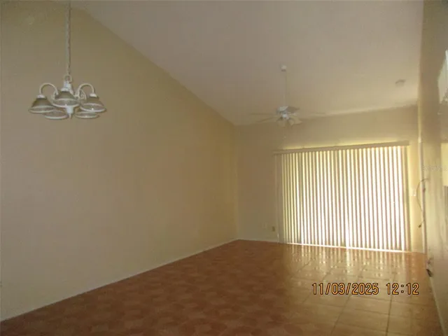 an empty room with a empty space and windows