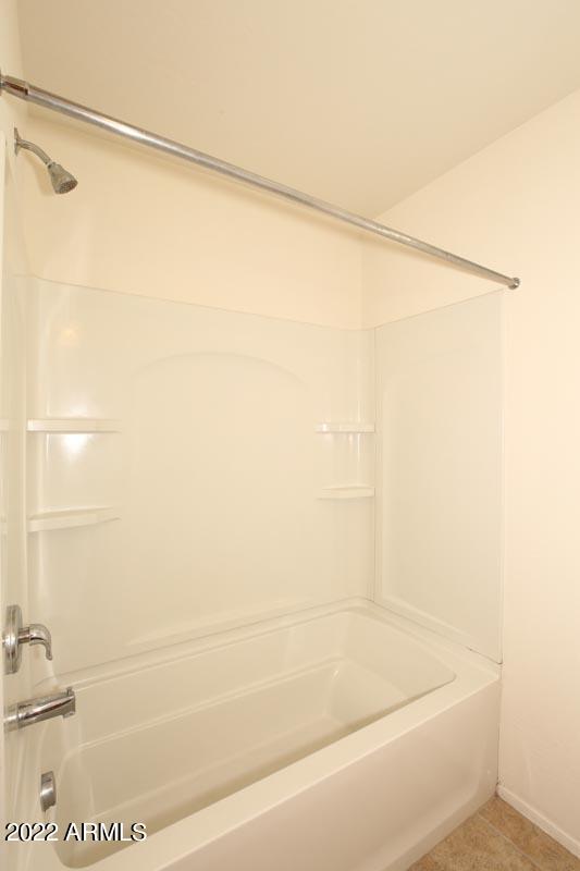 4717 East Betty Elyse Lane Phoenix, AZ 85032 - Photo 16 of 25 a bathroom with a shower and a glass door