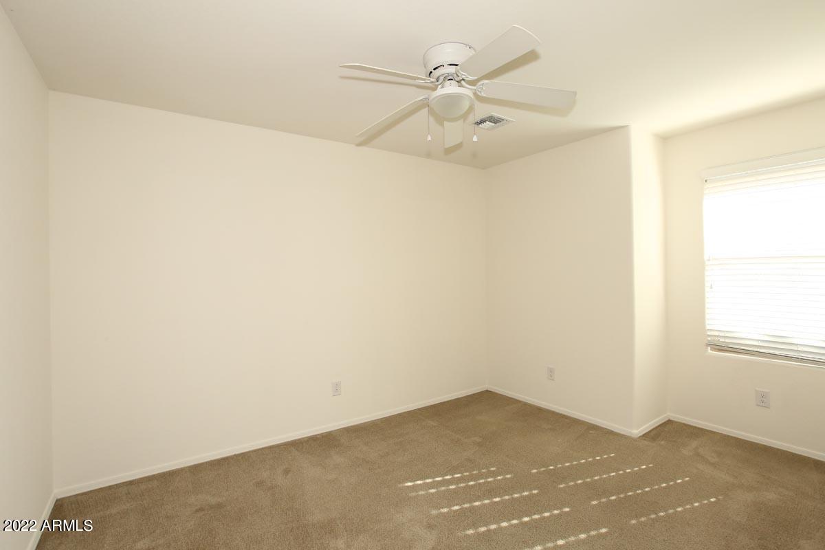 4717 East Betty Elyse Lane Phoenix, AZ 85032 - Photo 17 of 25 an empty room with a window
