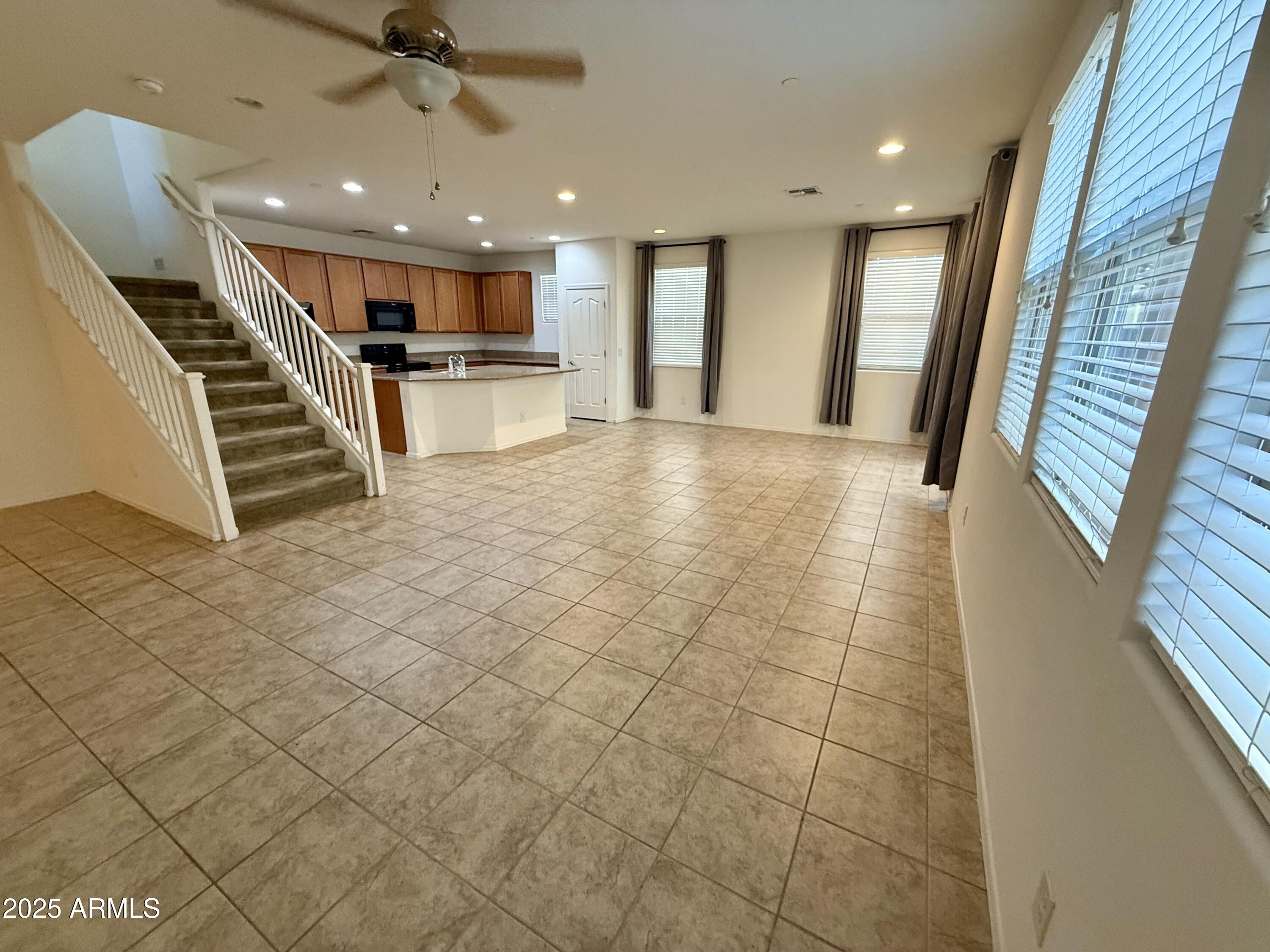 4717 East Betty Elyse Lane Phoenix, AZ 85032 - Photo 5 of 25 a view of a hall with kitchen and sink