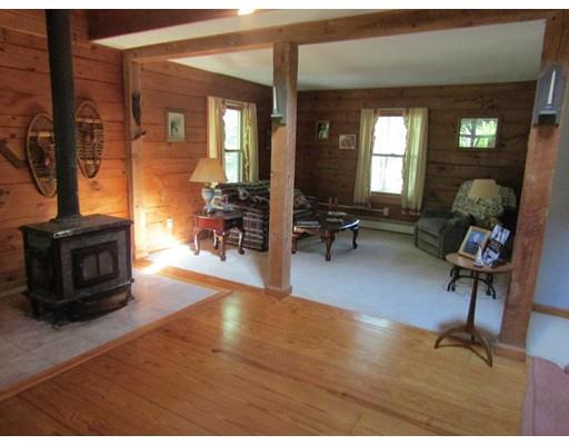 171 Nichewaug Road Petersham, MA 01366 - Photo 6 of 16 a living room with furniture and a fireplace
