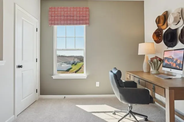 a workspace with furniture and window