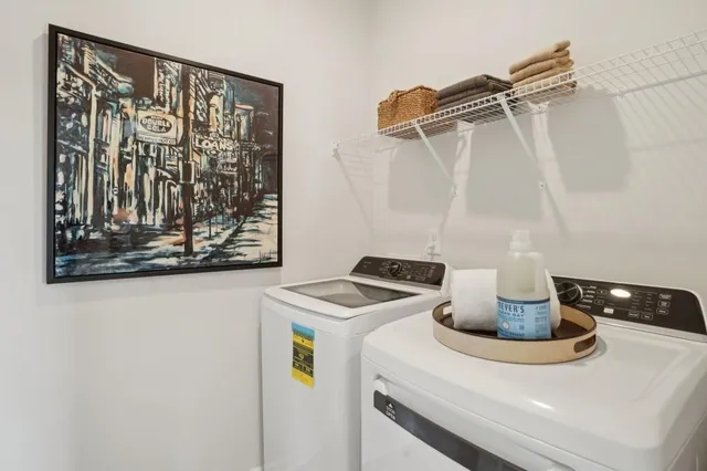a kitchen with a refrigerator and a stove