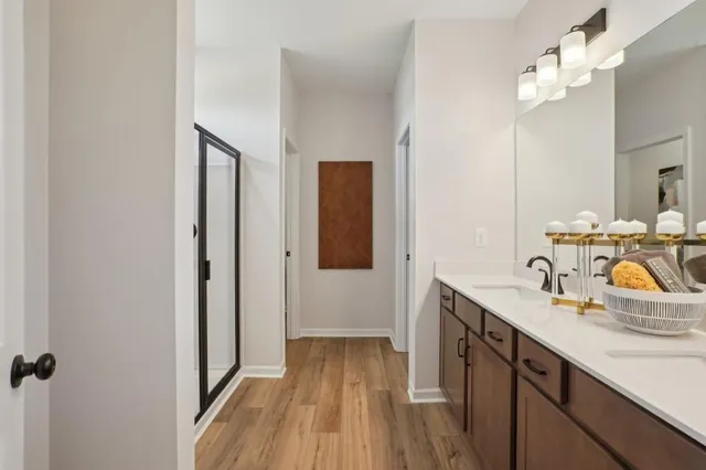 a bathroom with a sink a mirror and vanity