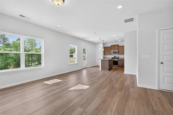 a view of a kitchen with a sink and a window