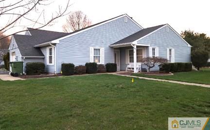 132 Woodbury Road Edison, NJ 08820 - Photo 1 of 1 a front view of house with yard and green space