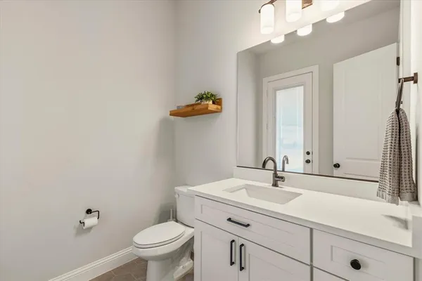 a bedroom with furniture and a large window
