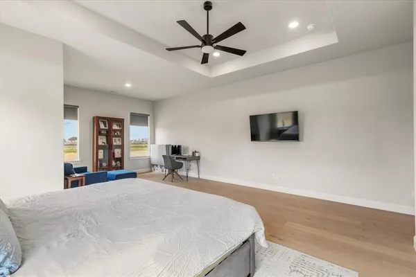 a bathroom with a sink a toilet a mirror and shower