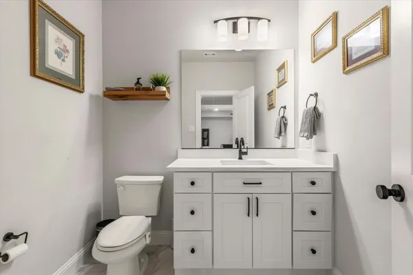 a spacious bedroom with a bed and a window