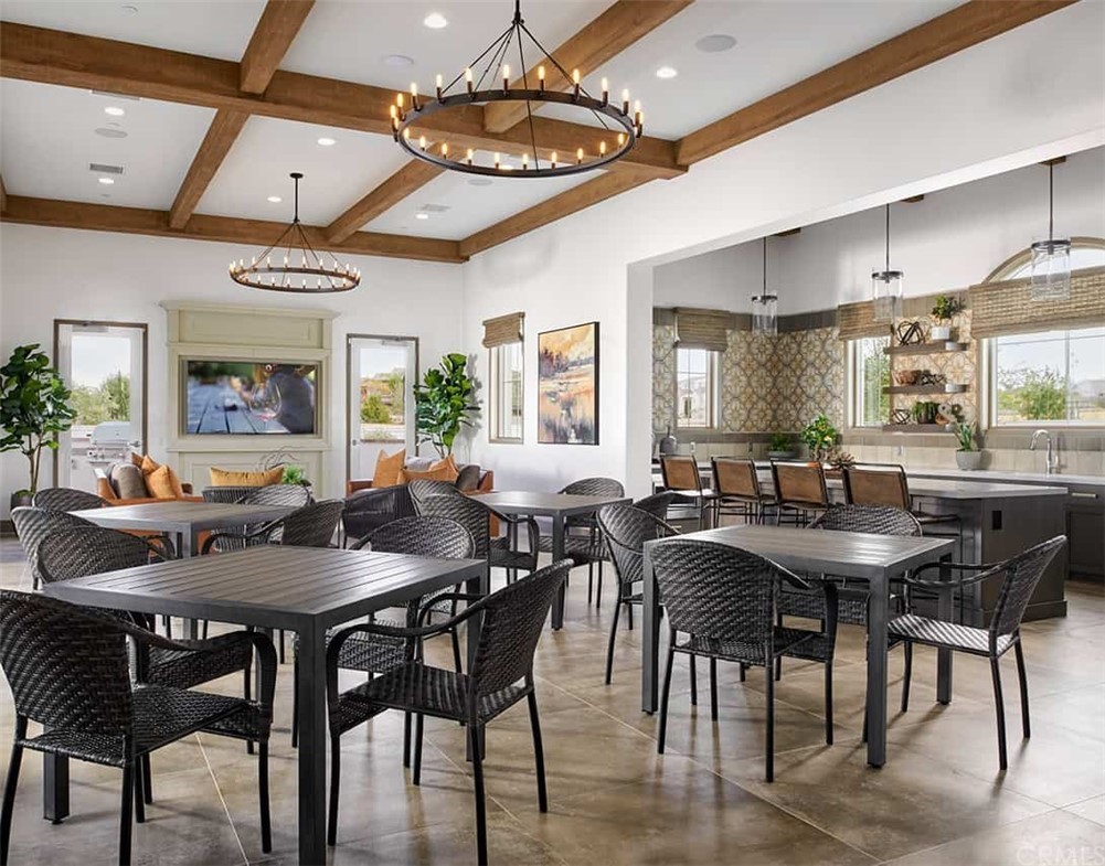 45283 Via Vela Temecula, CA 92592 - Photo 23 of 26 a view of a dining room with furniture and chandelier