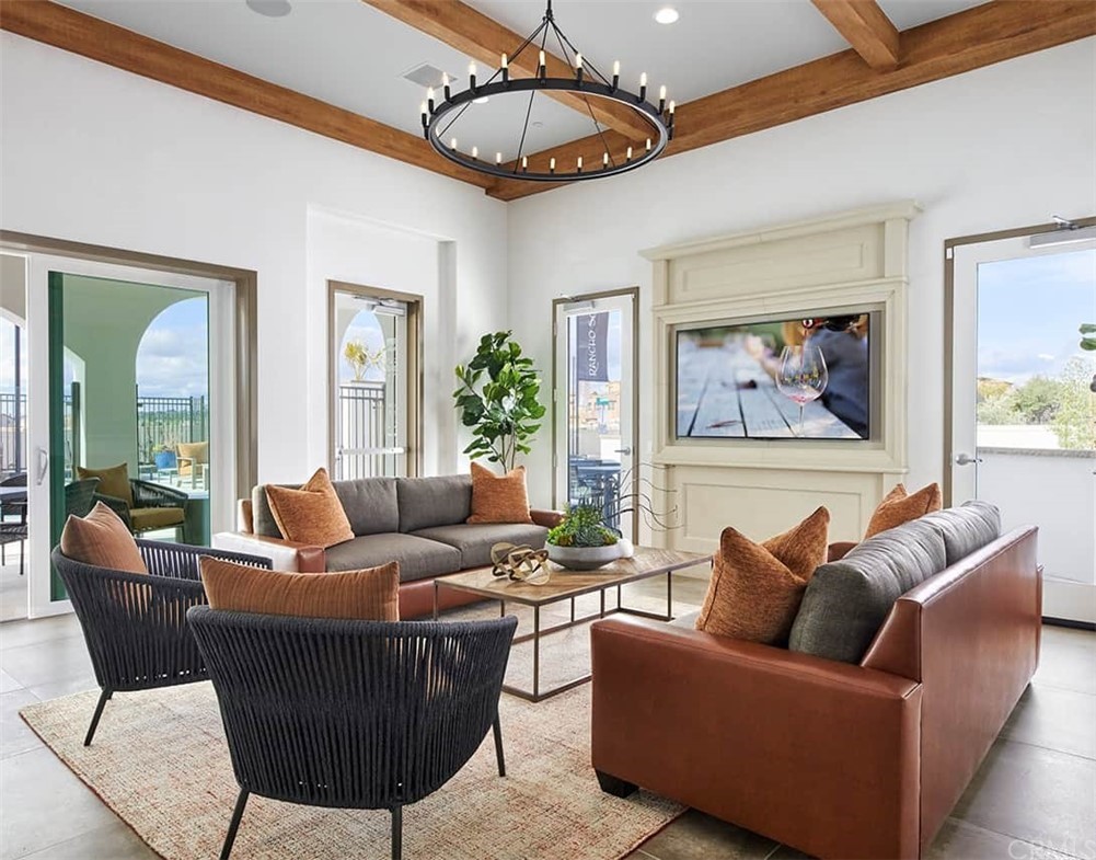 45283 Via Vela Temecula, CA 92592 - Photo 25 of 26 a living room with furniture a ceiling fan and a rug