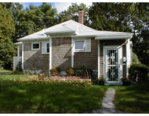21 A Cahoon Road Wareham, MA 02532 - Photo 2 of 8 a front view of a house with a yard and garage
