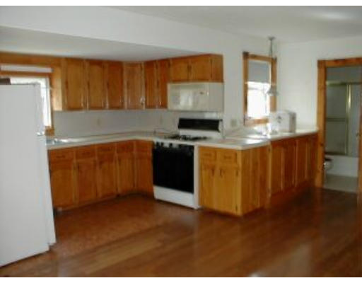 21 A Cahoon Road Wareham, MA 02532 - Photo 5 of 8 a kitchen with stainless steel appliances granite countertop a stove a sink and a refrigerator