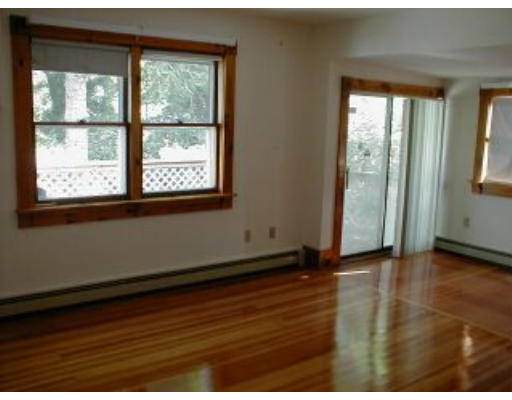 21 A Cahoon Road Wareham, MA 02532 - Photo 7 of 8 a view of an empty room with wooden floor and a window