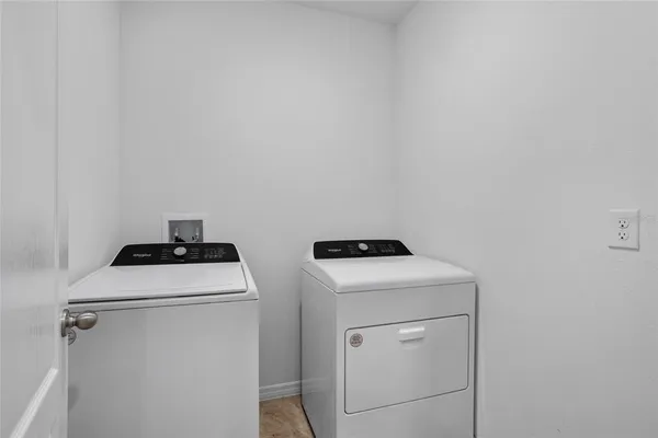 a utility room with dryer and washer