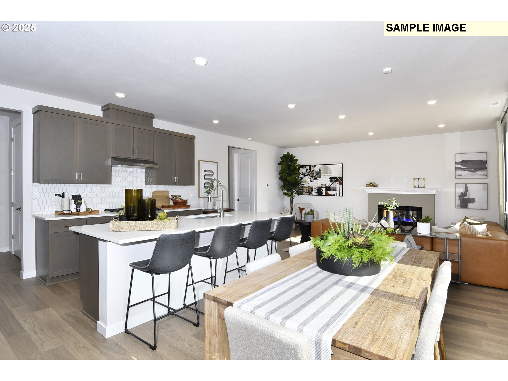 3103 Southwest 4th Avenue Battle Ground, WA 98604 - Photo 17 of 33 a living room with furniture a fireplace and a kitchen view