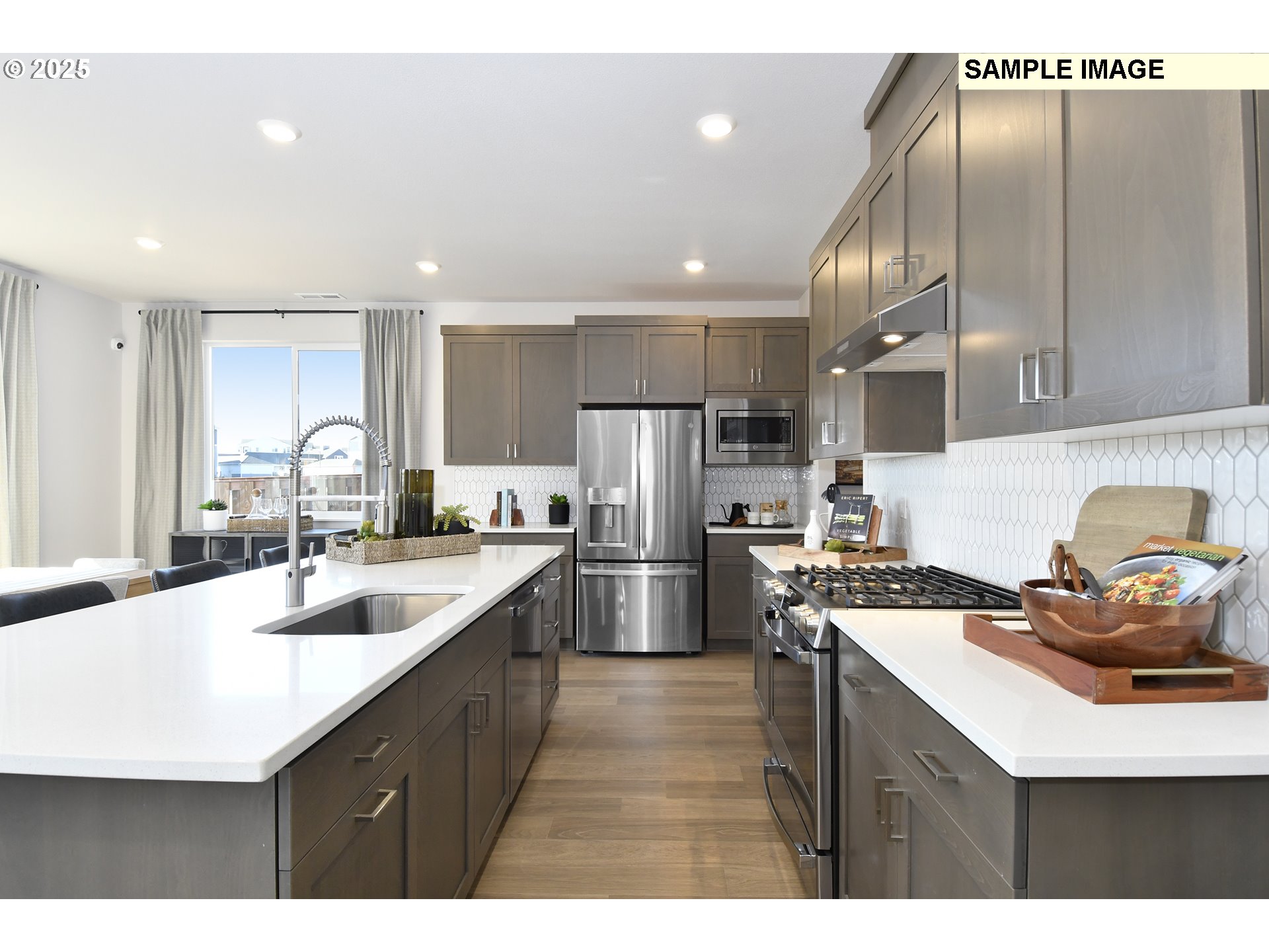 3103 Southwest 4th Avenue Battle Ground, WA 98604 - Photo 22 of 33 a kitchen with kitchen island a sink stove and refrigerator