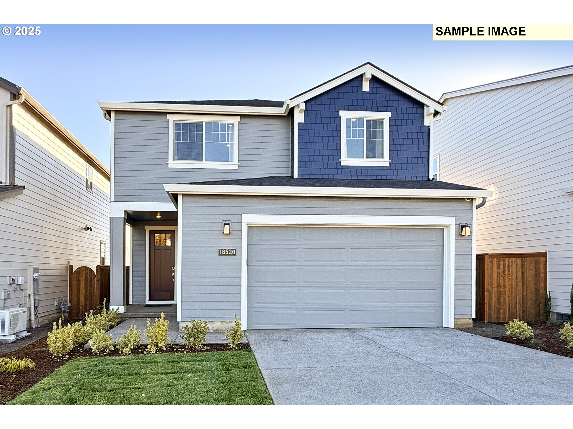 3103 Southwest 4th Avenue Battle Ground, WA 98604 - Photo 27 of 33 a front view of a house with a yard and garage