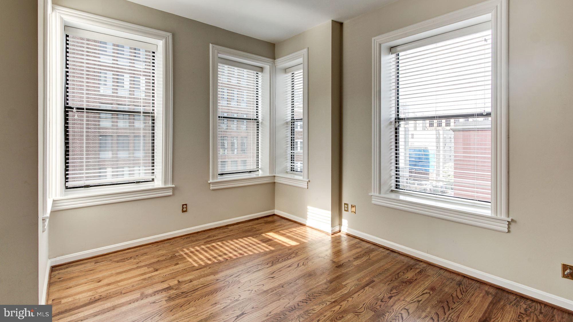 2101 N Street Northwest, Unit 301 Washington, DC 20037 - Photo 8 of 16 Light-filled living room