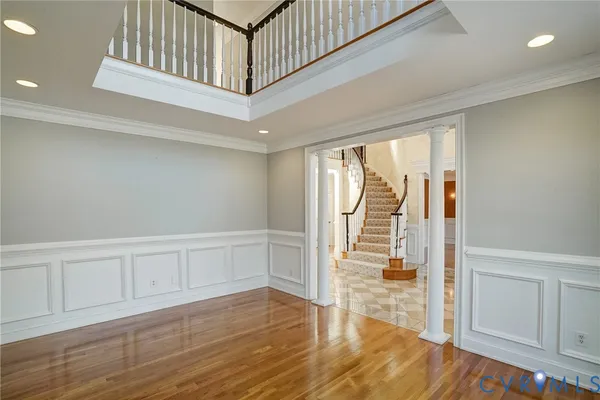 a view of an entryway with wooden floor