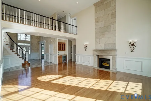 a view of livingroom kitchen and hall with wooden floor