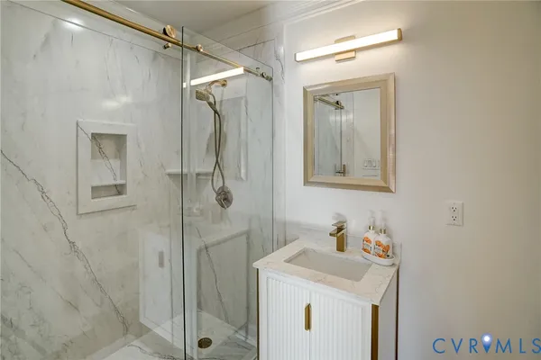 a bathroom with a sink a vanity and a mirror