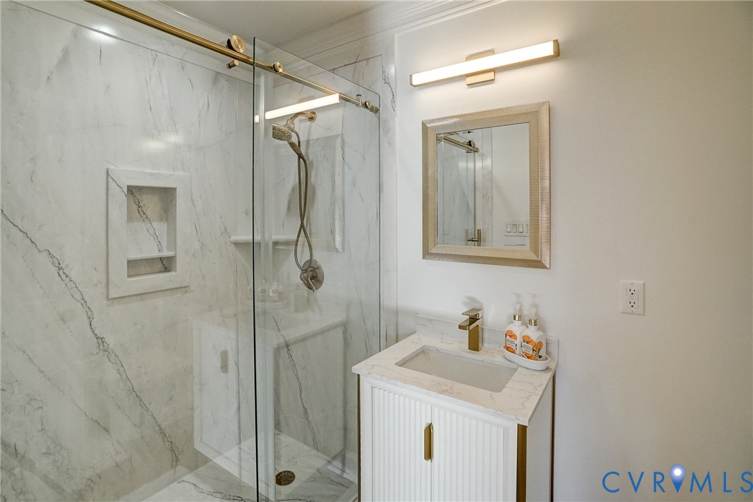 721 Meadow View Ridge Manakin-Sabot, VA 23103 - Photo 32 of 50 a bathroom with a sink a vanity and a mirror