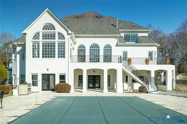 a view of a white building with many windows