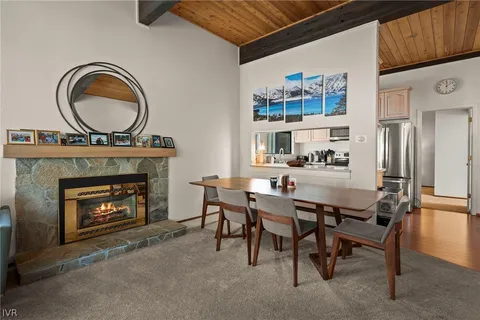 a dining room with furniture and a fireplace