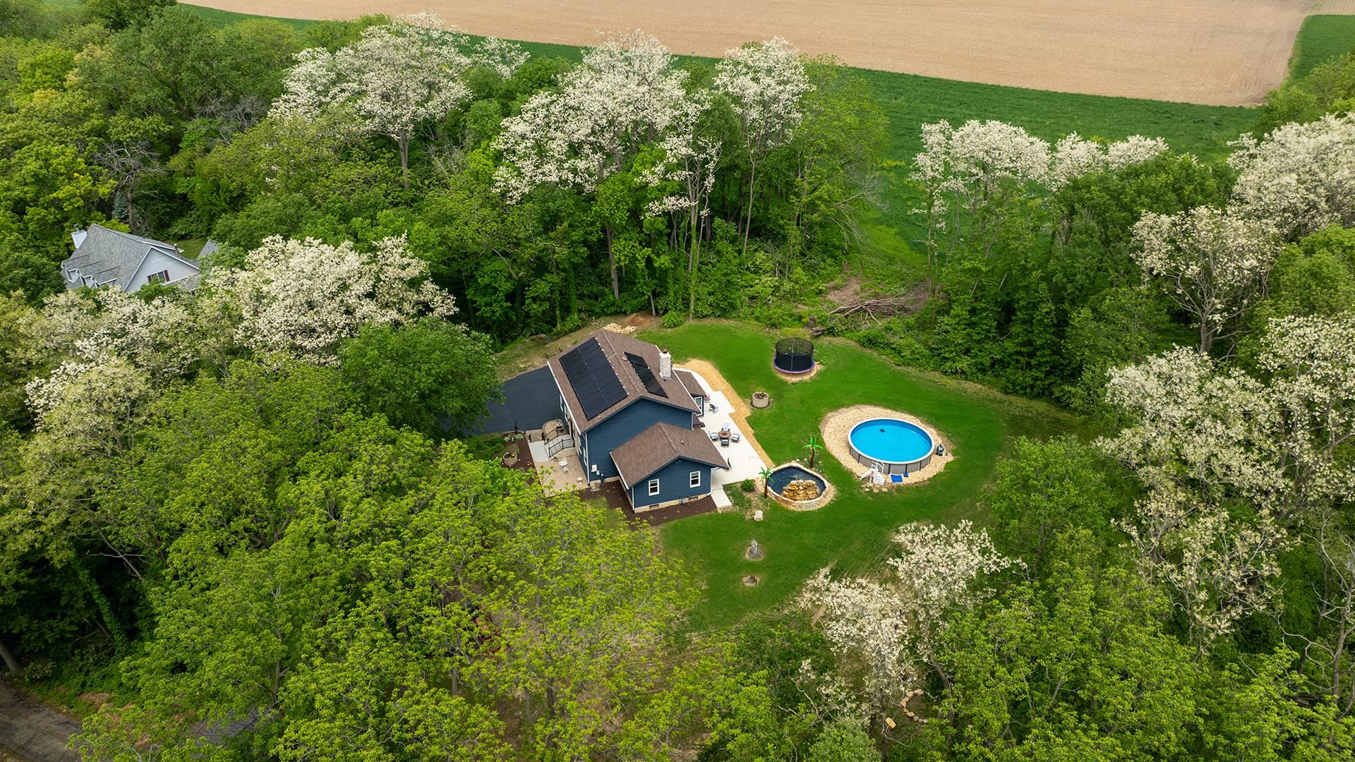 293 Briar Court Oregon, IL 61061 - Photo 1 of 58 an aerial view of a golf course with trees