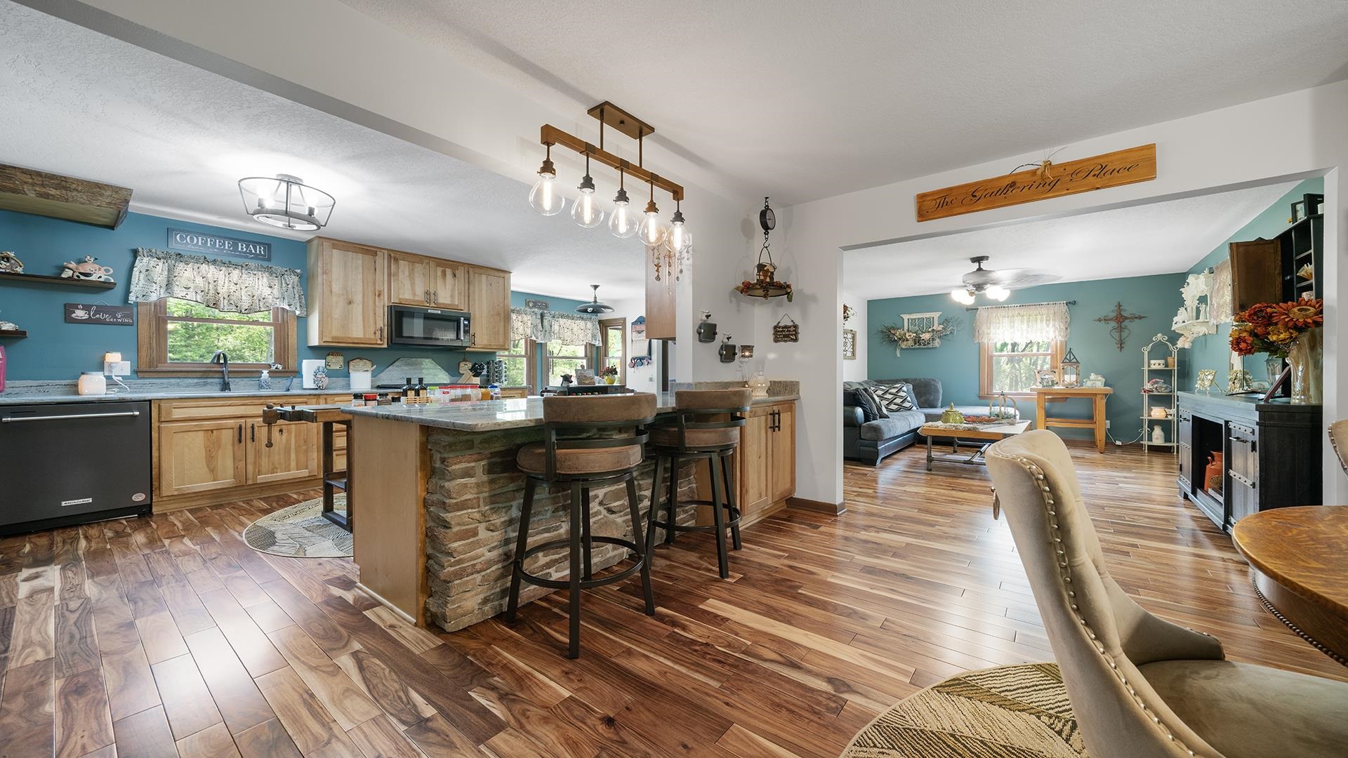 293 Briar Court Oregon, IL 61061 - Photo 13 of 58 a large kitchen with a table and chairs