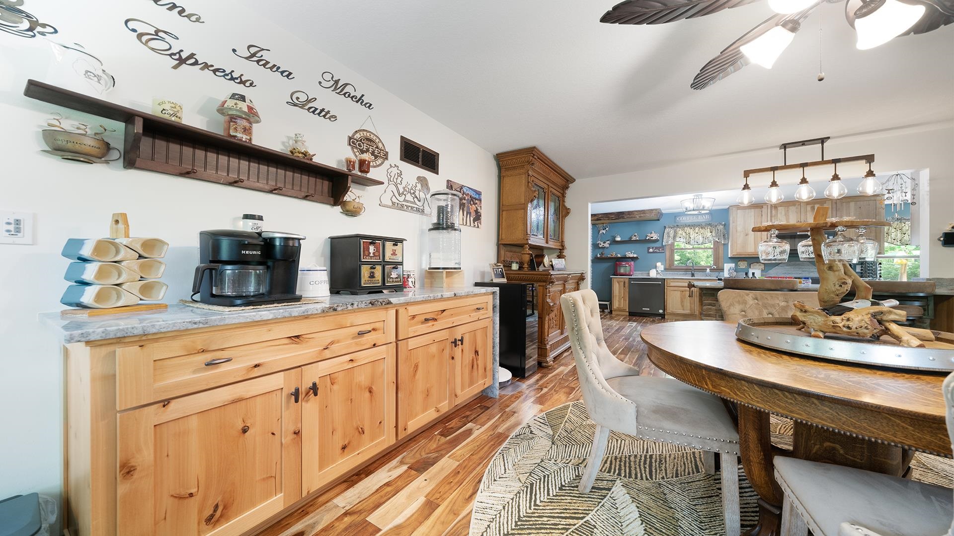 293 Briar Court Oregon, IL 61061 - Photo 15 of 58 a large kitchen with a table and chairs