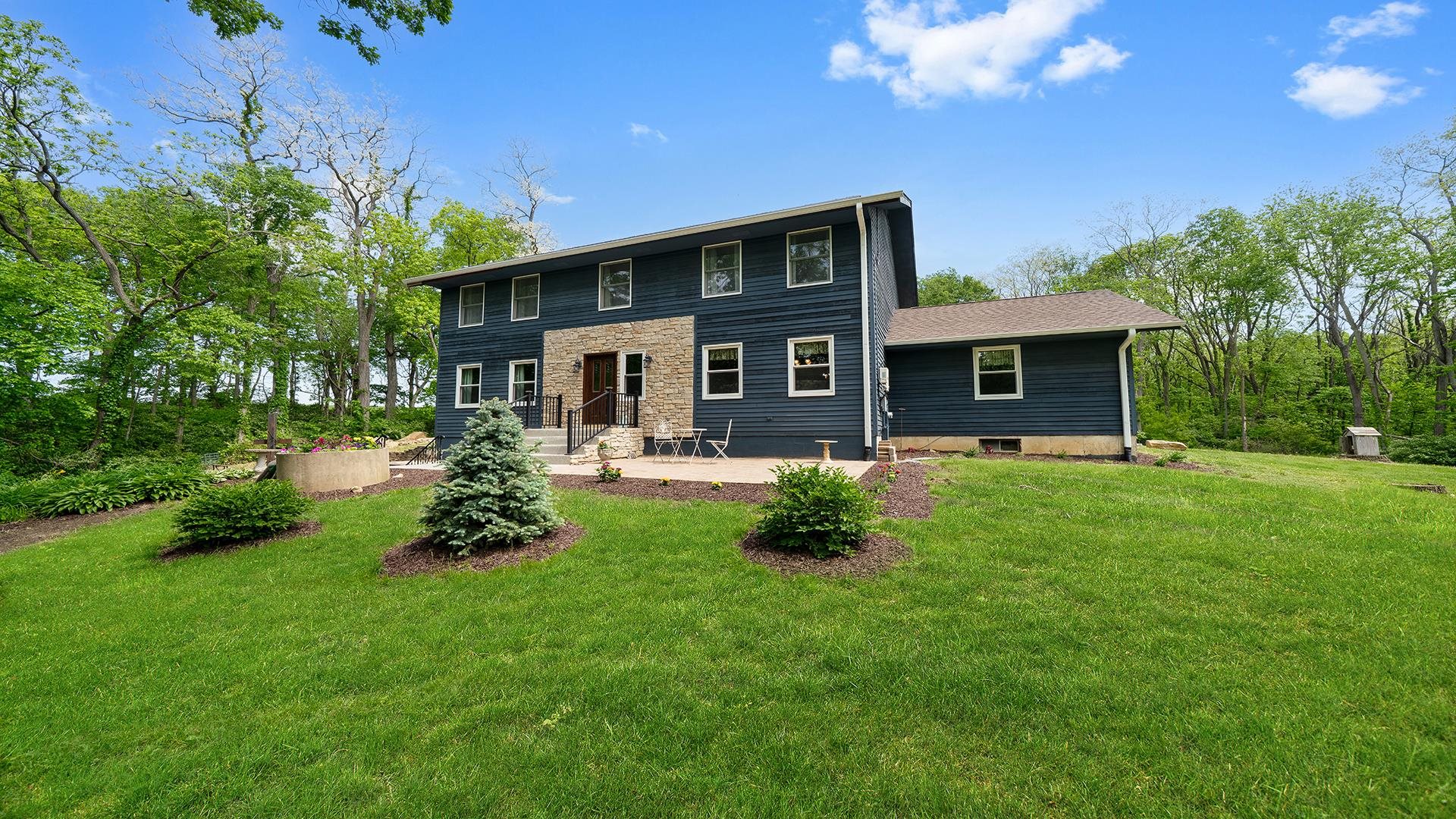 293 Briar Court Oregon, IL 61061 - Photo 2 of 58 a front view of house with yard and green space