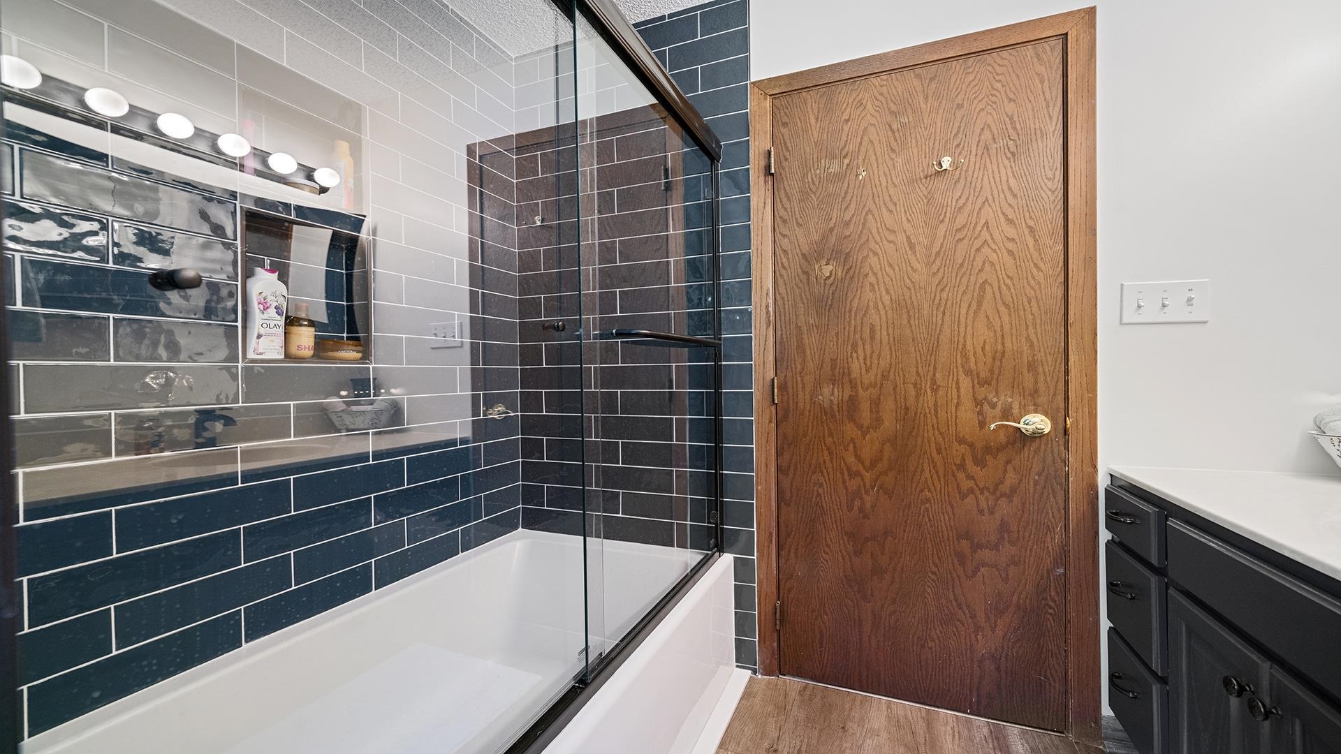 293 Briar Court Oregon, IL 61061 - Photo 28 of 58 a bathroom with a bathtub and shower