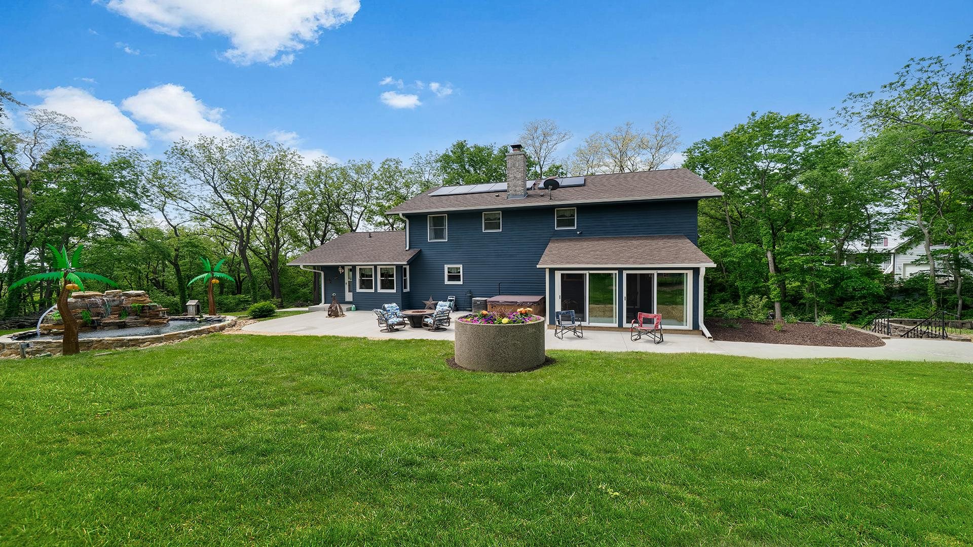 293 Briar Court Oregon, IL 61061 - Photo 50 of 58 a front view of a house with garden and trees