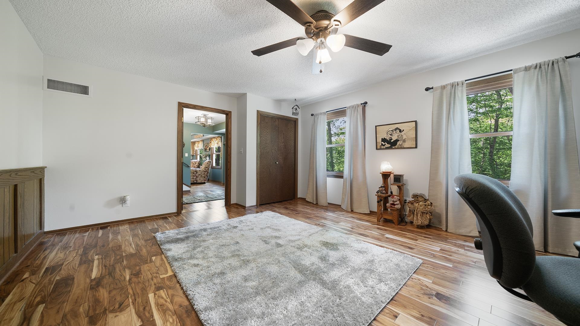 293 Briar Court Oregon, IL 61061 - Photo 7 of 58 a view of a livingroom with a furniture window and wooden floor