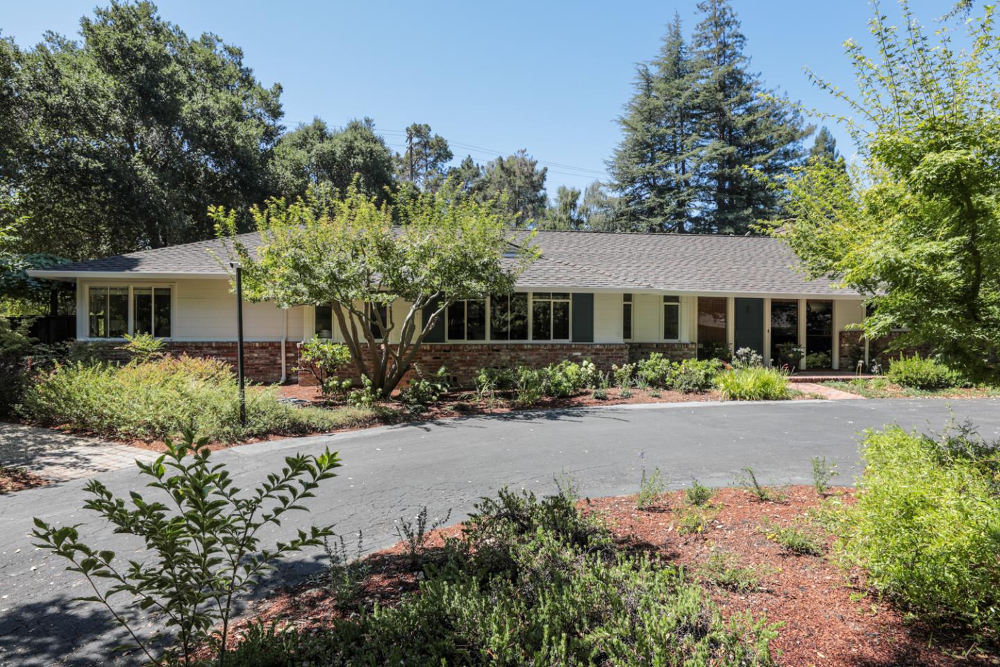 3 Irving Avenue Atherton, CA 94027 - Photo 1 of 22 a front view of a house with a yard and outdoor seating