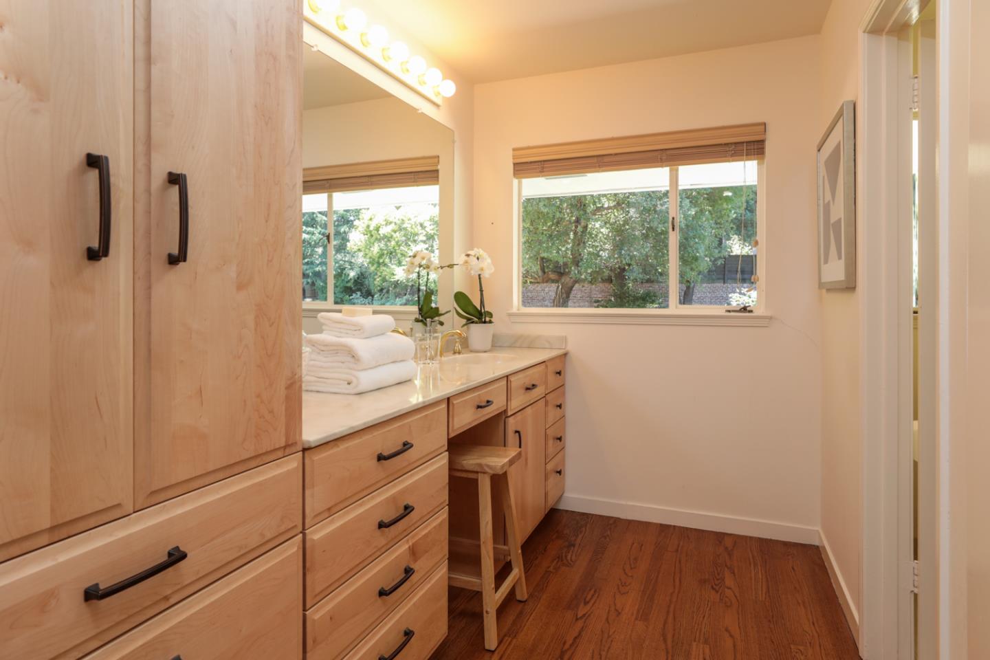 3 Irving Avenue Atherton, CA 94027 - Photo 16 of 22 a bathroom with a sink a mirror and a shower